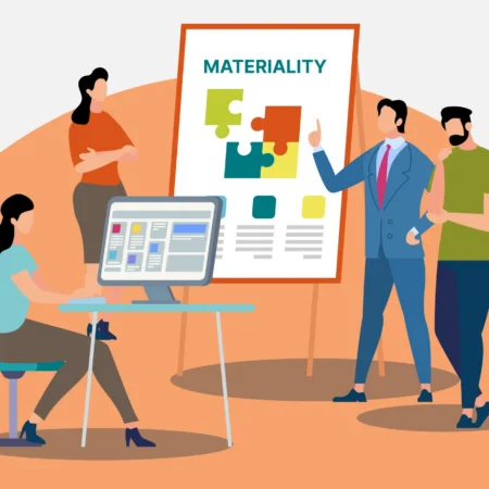 banner image for the What is a Materiality Matrix: Key Components and How to Build article, showing the Presgo logo and four persons at work, discussing with a computer monitor and a chart board with puzzle pieces